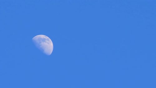 Waxing Gibbous Moon View in Blue Sky
