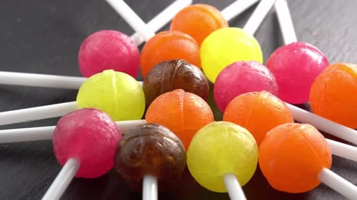 Assorted Colorful Lollipops on Dark Background