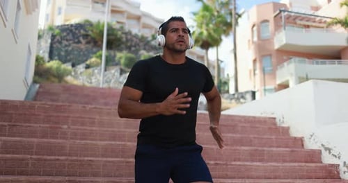 Man Doing Workout In The City While Listening Music - Sport, Workout And Healthy Lifestyle