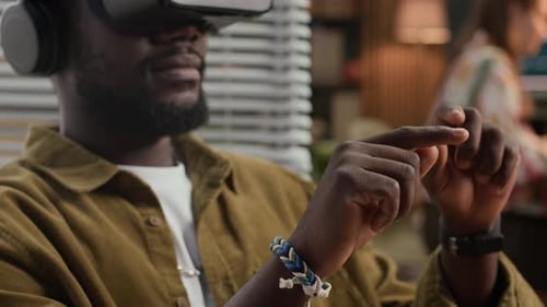 Man Using Virtual Reality Headset at Workplace