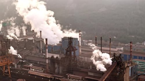Wide Angle Drone View of an Industrial Plant with Smoking Factory Chimneys