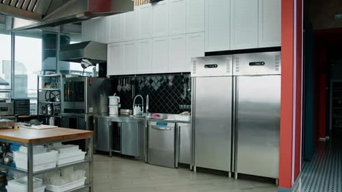 Professional commercial empty clean modern kitchen in restaurant or cafe Metal kitchen equipment