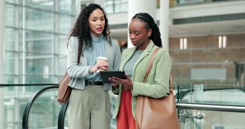 Discussion, tablet and business woman in the office planning project together by the escalator