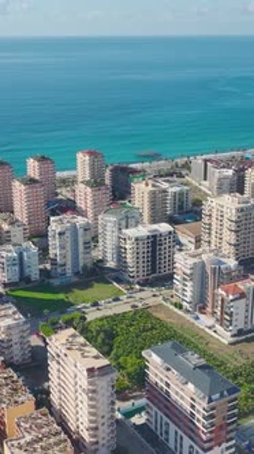 Aerial View of Coastal City and Blue Ocean