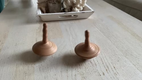 Wooden Spinning Top Spinning on a Table