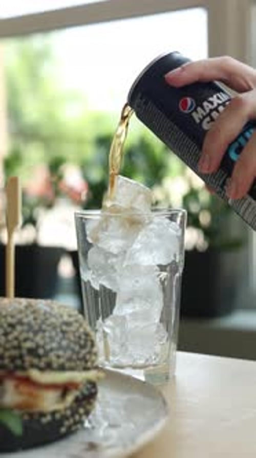 A girl prepares drinks at a bar