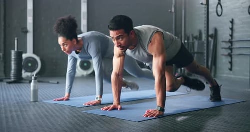 Couple, fitness and gym workout of training friends together for a core strength exercise for abs