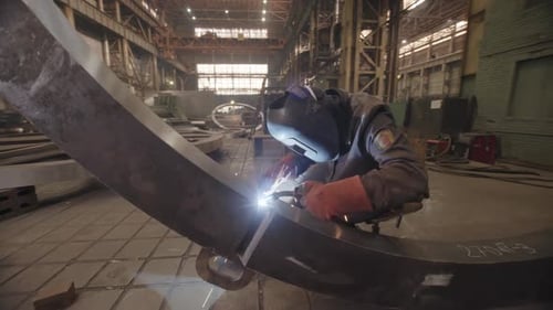 A Welder Demonstrating Expertise in an Industrial Workshop Showcasing Mastery in Fabrication Stock