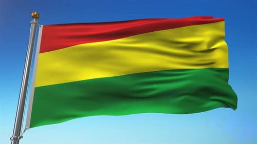 Waving Flag of Red Yellow Green Against Blue Sky