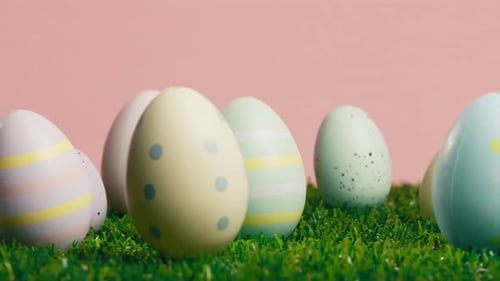 Rotating Painted Easter Eggs on Green
