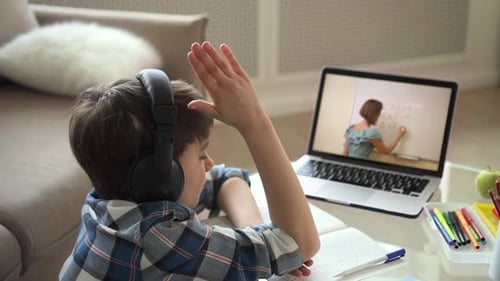 Child Studying With Online Teacher and Laptop