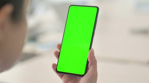 Close Up of Woman Using Green Screen Smartphone