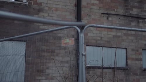 Dangerous building after fire surrounded by fencing