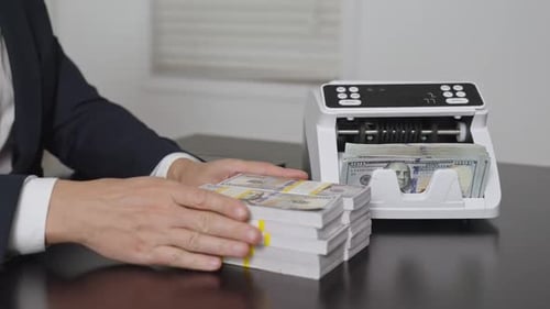 Counting Dollars Hand and Money Counter Management in Office Investment Concept Finance Managers