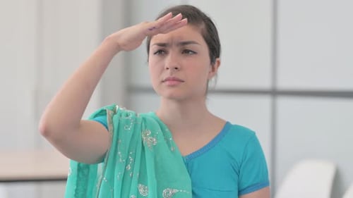 Portrait of Indian Woman in Sari Searching for Opportunity