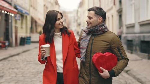 Happy Couple in Love Caucasian Family Walking Around the City Talking Spending Time Together