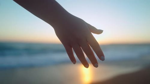 Romantic Couple Holding Hands at Beach During Sunset