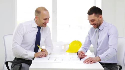 Business, Architecture and Office Concept - Two Smiling Businessmen or Architects With