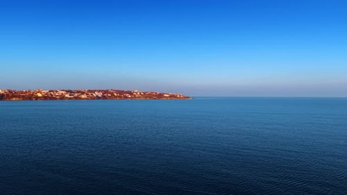 Aerial View of Coastal City on Sunny Day