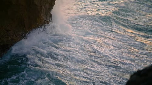 Ocean Splashing Cliffside Nature at Morning Closeup. Big Waves Crash Volcanic Rocks