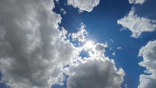 Sun Sometimes Sets Sometimes Peeks Out From Behind the Clouds