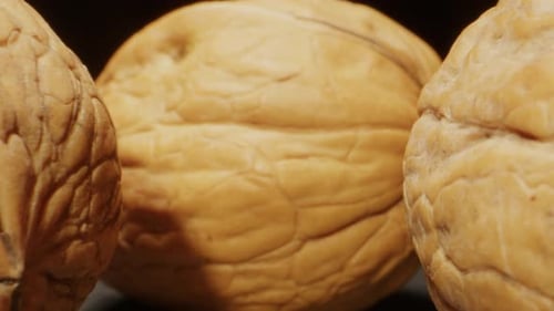 Close-up of Walnuts Against Dark Background
