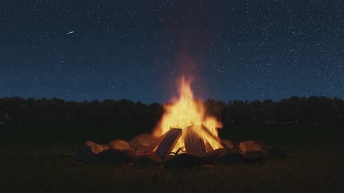 Loop Of A Campfire On An Open Meadow And In Front Of A Starry Sky