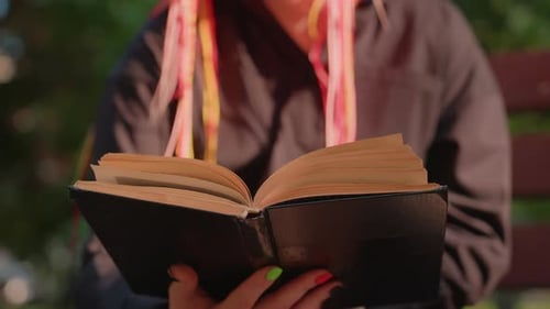 Reader in Park Reader Leisurely Flipping Pages on Park Bench Under Shade Individual with Colorful