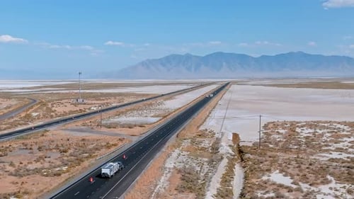 Highway Through the Desert Sands and Salt Flats of the Blue Sky
