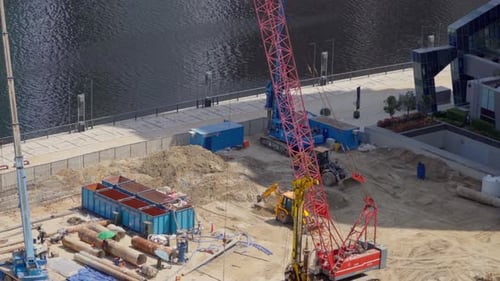 Crane and Construction Equipment at Urban Building Site