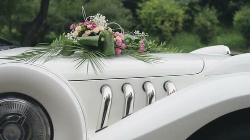 White Classic Car Decorated with Flowers for Wedding