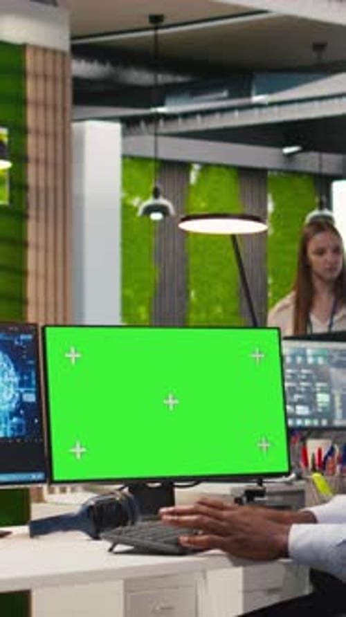 Vertical Video Software Developer Using AI on Green Screen Computer to Optimize Performance