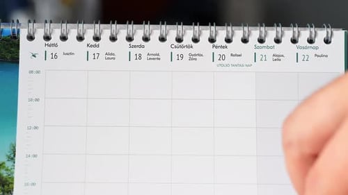 Close-up of a Hungarian weekly calendar showing the days from Monday to Saturday, with names