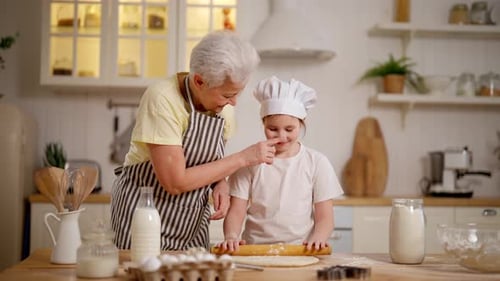 Cheerful Adult and Child Baking Together at Home