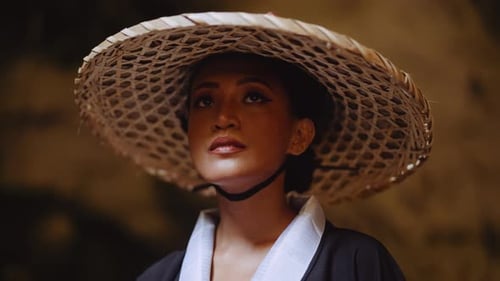 Woman Posing Wearing a Conical Hat