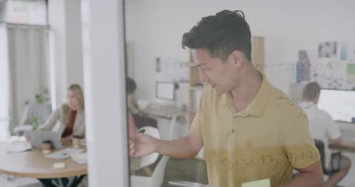 Team Collaborating on a Project in an Office