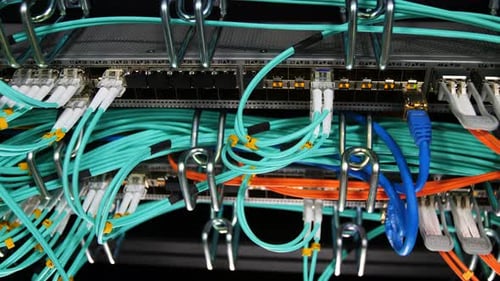 Closeup Motion Along Mining Farm Servers with Cables