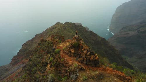 Successful Middle Aged Woman Enjoys Nature Landscape on Mountain Top