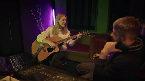 Woman Singer and Producer in Recording Studio Lady Guitarist Singing Song Audition and Meeting of