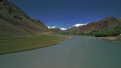 Mountain River Overlooking Mountain Peaks