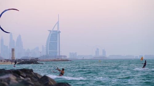 Kite surfers enjoy idyllic conditions at Fazza beach Dubai against the iconic Burj Al Arab skyline
