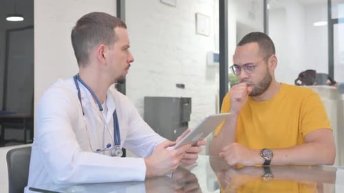 Doctor Consults with Patient in Clinic