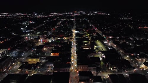 Illuminated cityscape of american town in winter Christmas season. Quiet lighting straight street wi
