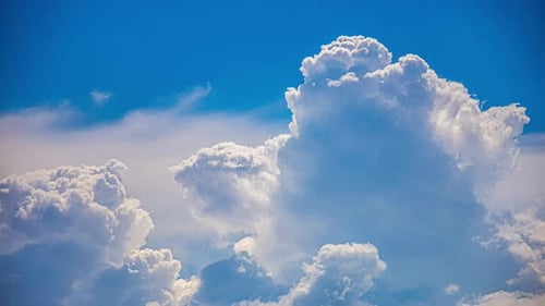 Time lapse of fluffy white clouds in clear blue sky, white cloud cloudscape, view from above, sunny