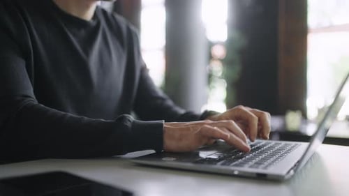 Freelancer Working Remotely Typing Message On Keyboard Of Laptop Closeup View Of Male Hands