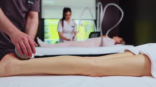 Massage on Woman's Legs in Medical Spa
