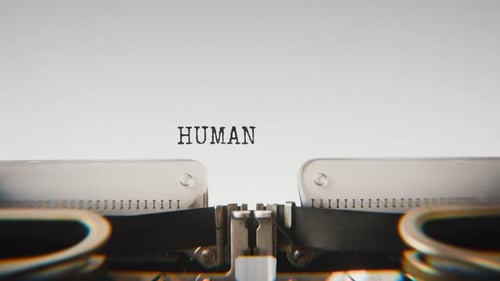 Old mechanical typewriter typing Human Nature in a close-up view.