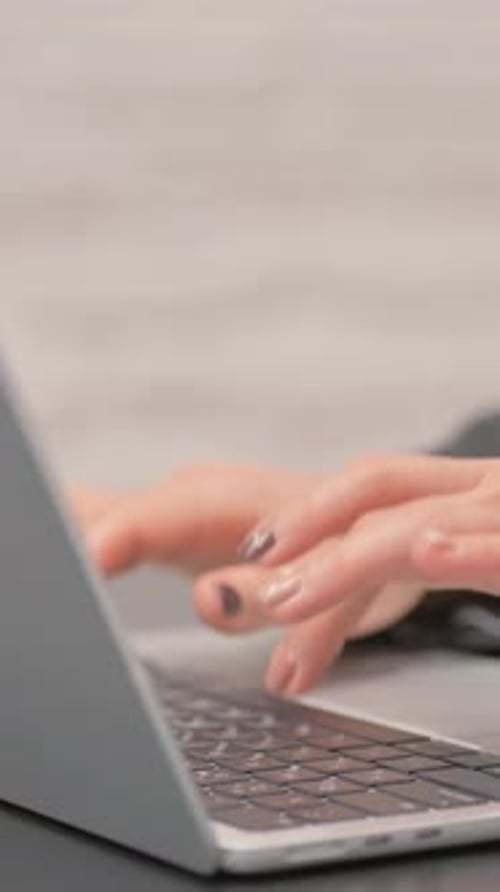 Close up Female Hands Working on Laptop, vertical video