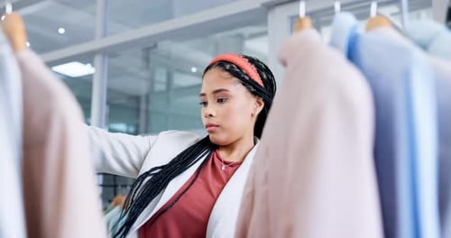 Clothes, woman and customer in a store, shopping and fashion with retail, expensive items and sales