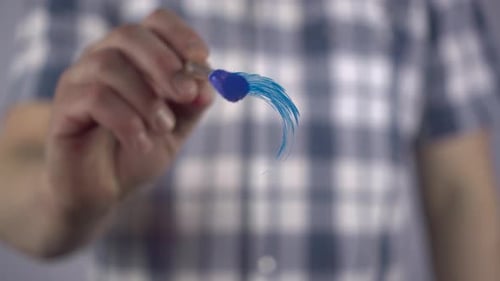 A Man Draws a Male Symbol on the Glass
